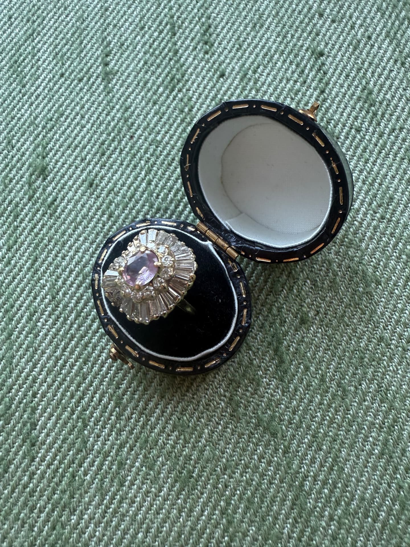 Amethyst and diamond ballerina cluster ring in an antique leather box